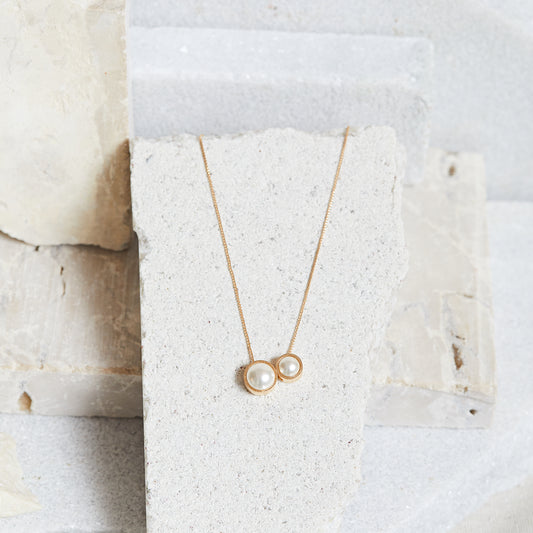 PINGENTE MEIA PÉROLA C/ OURO